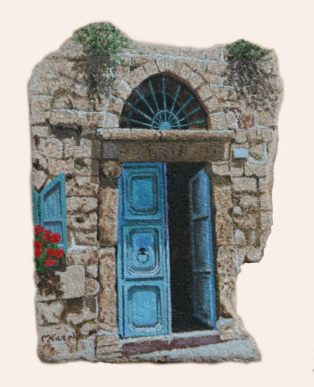 Blue doorway in an old Acre stone wall painted on kurkar stone.