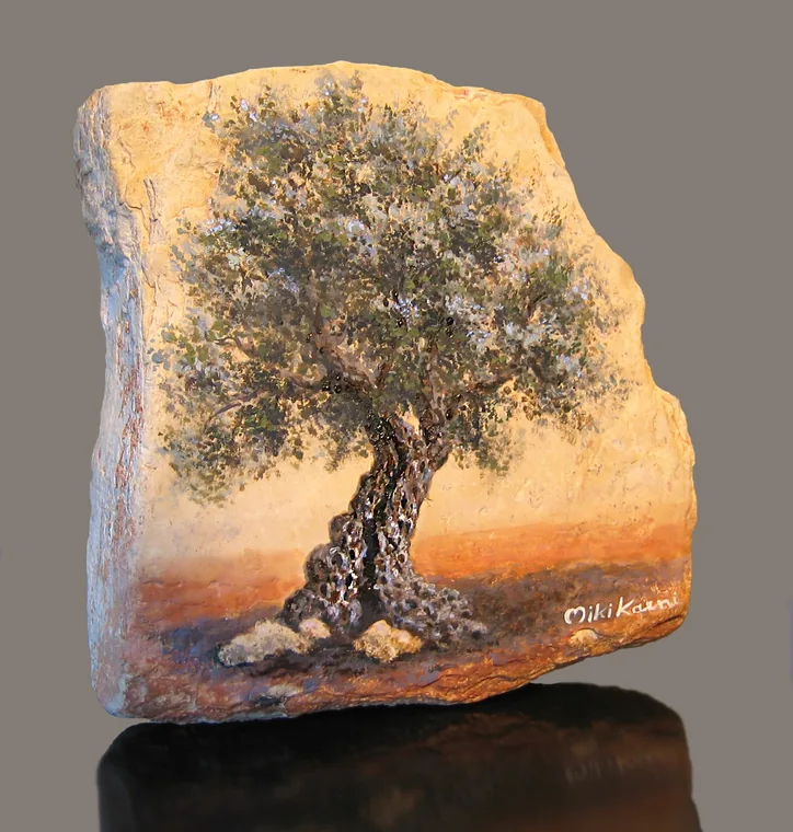 Olive tree painted on a freestanding piece of natural stone.
